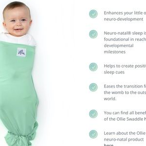 The Ollie world baby swaddle new without tags includes mesh washing bag